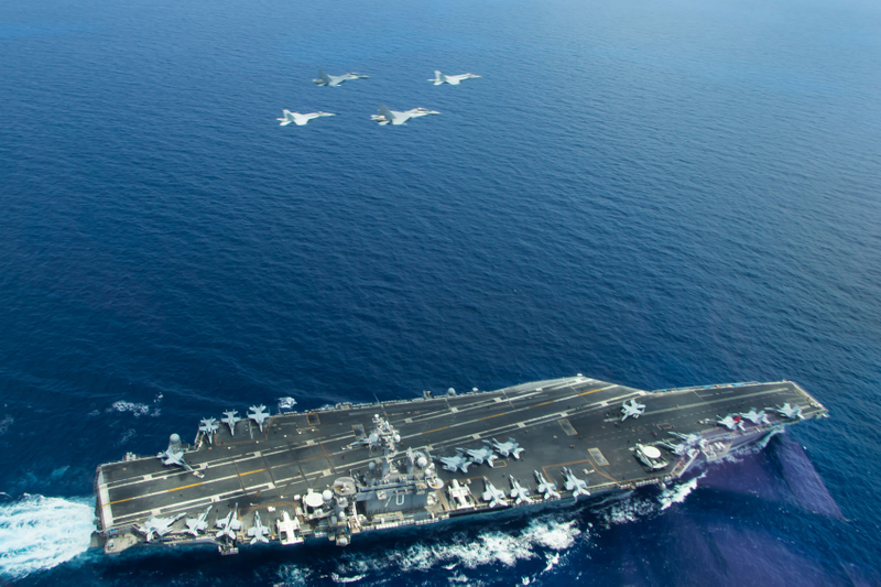 Illustration for article titled Navy Hornets Mock-Dogfight With Malaysian Flankers In South China Sea